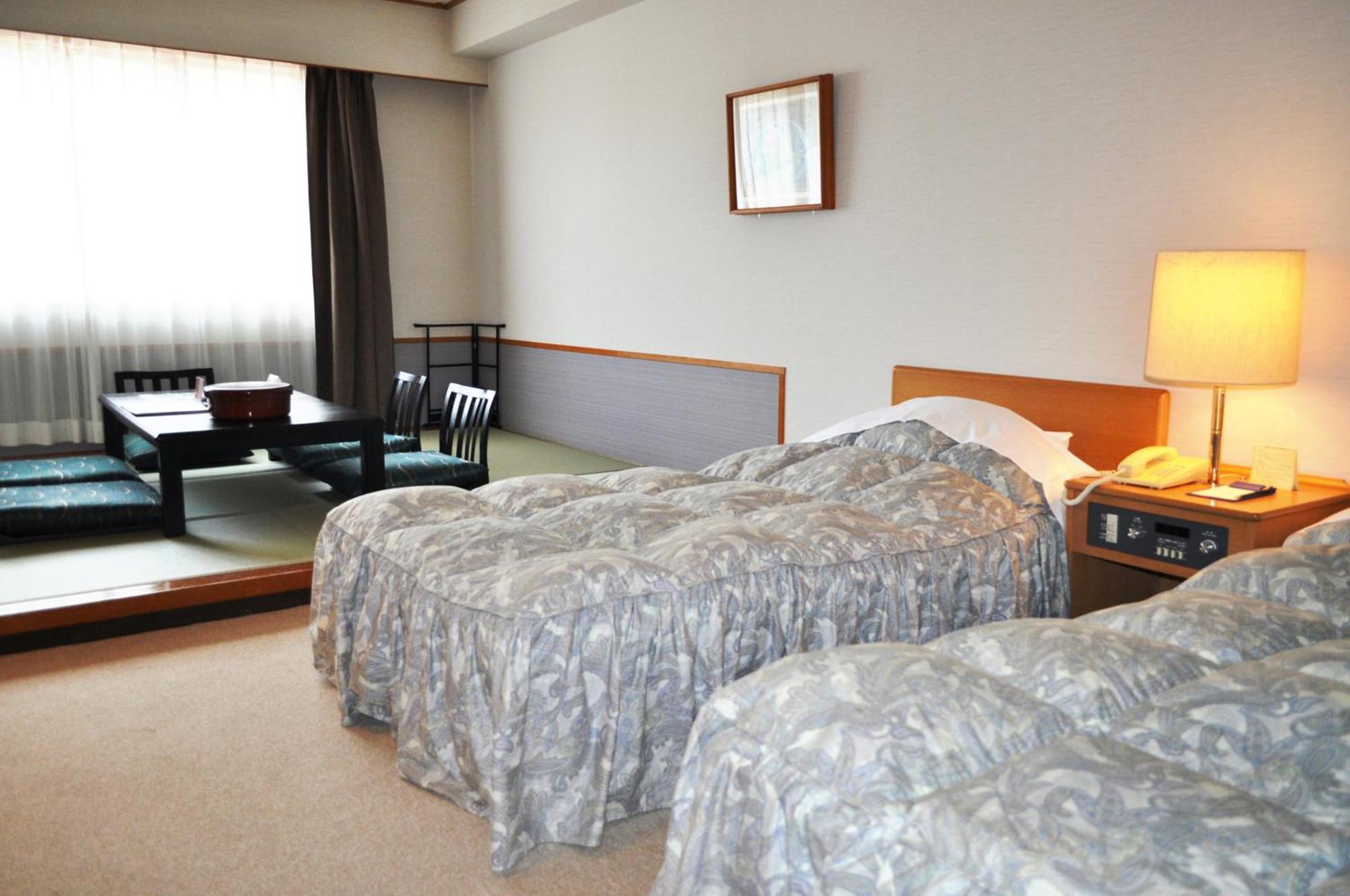 Tateyama Kokusai Hotel Toyama Station Quarto foto